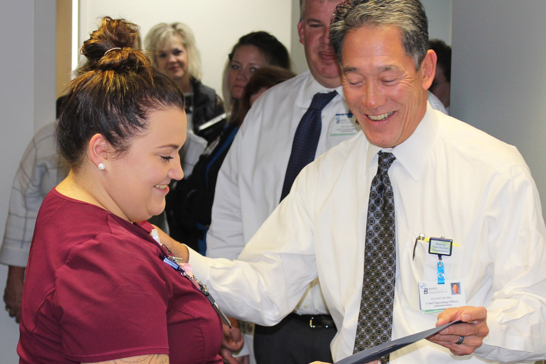 Cooksey receives award from Elliot Kuida, COO, Blessing Hospital