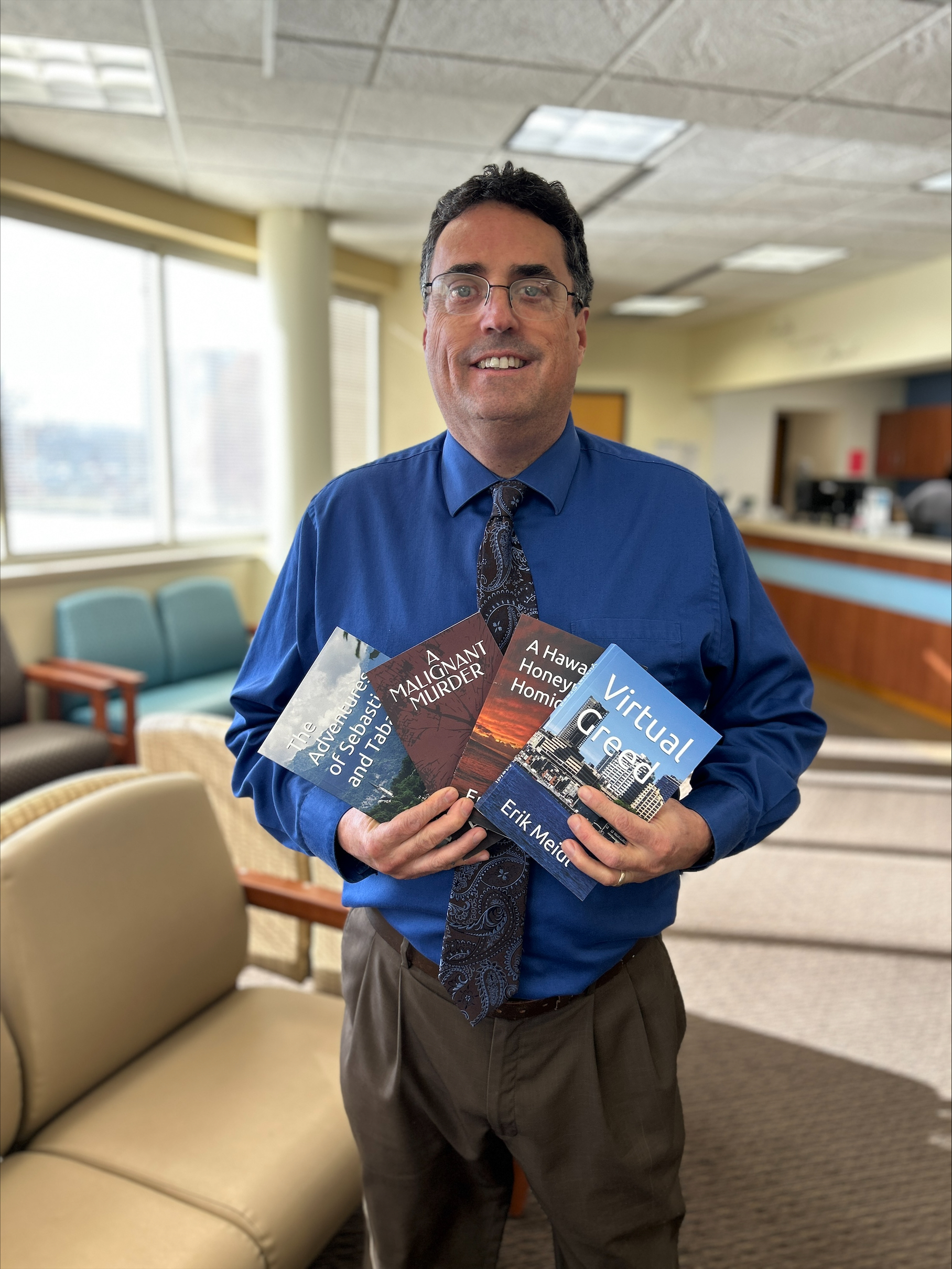 Dr. Meidl Blessing Health System with Books