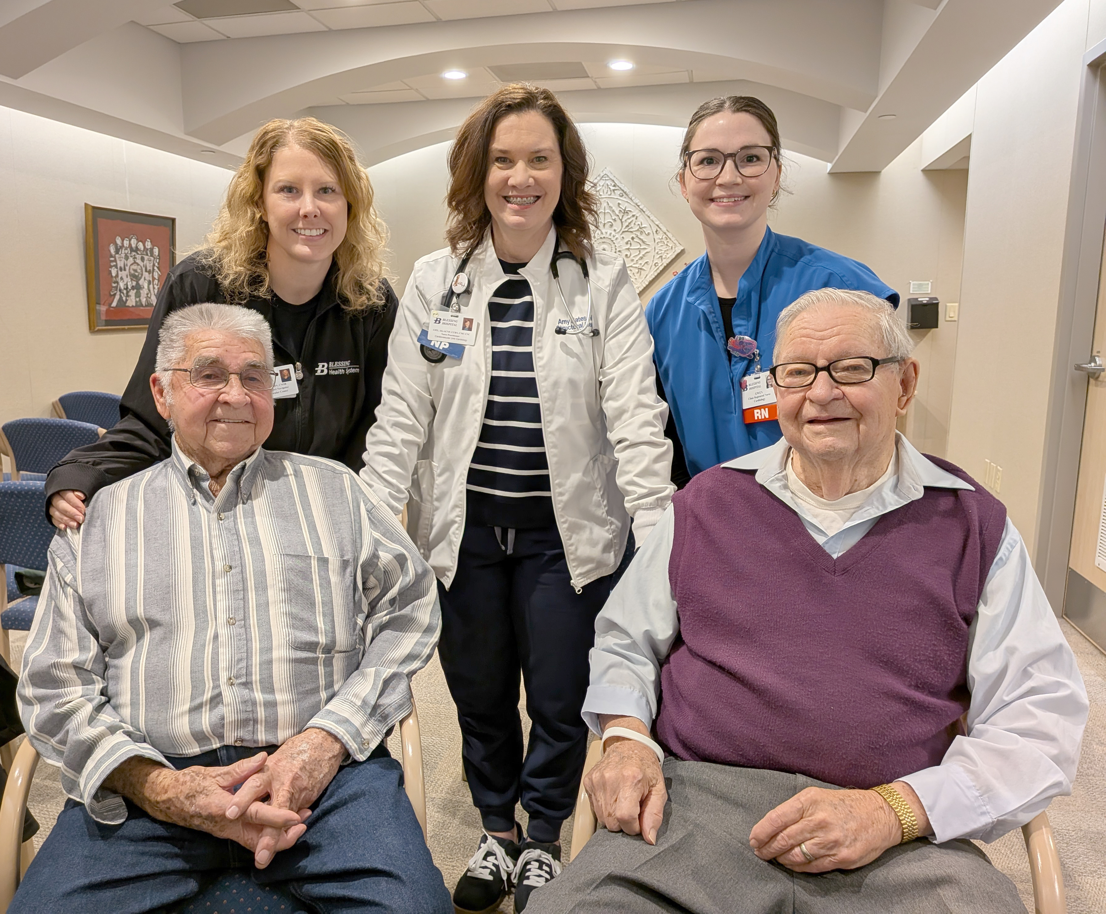 Donald Nagel (seated left) and Jim Nauert (seated right) with nurses (L to R) Diana Weatherford, Amy Bates and Gwen Little.