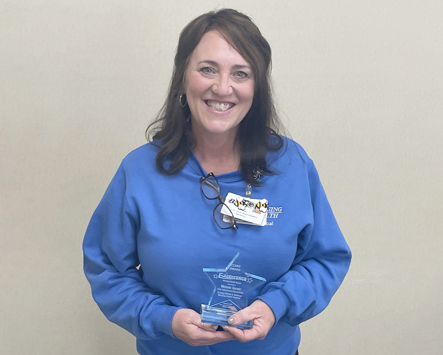 Melanie Garner with her ICARE Award for Excellence