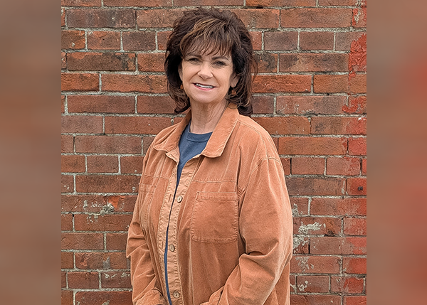 Joy Berhorst passes the “Pink Torch” forward