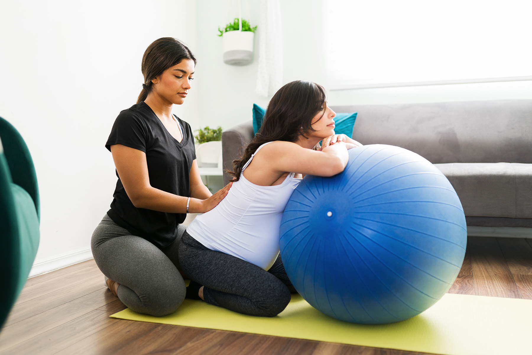 Doula working with pregnant woman