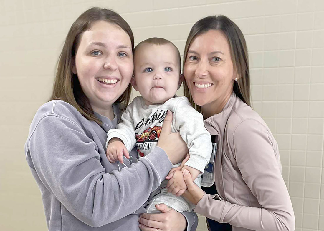 Katie and Miles Elmore and Lacy Nichols Blessing Neonatal Nurse Practitioner