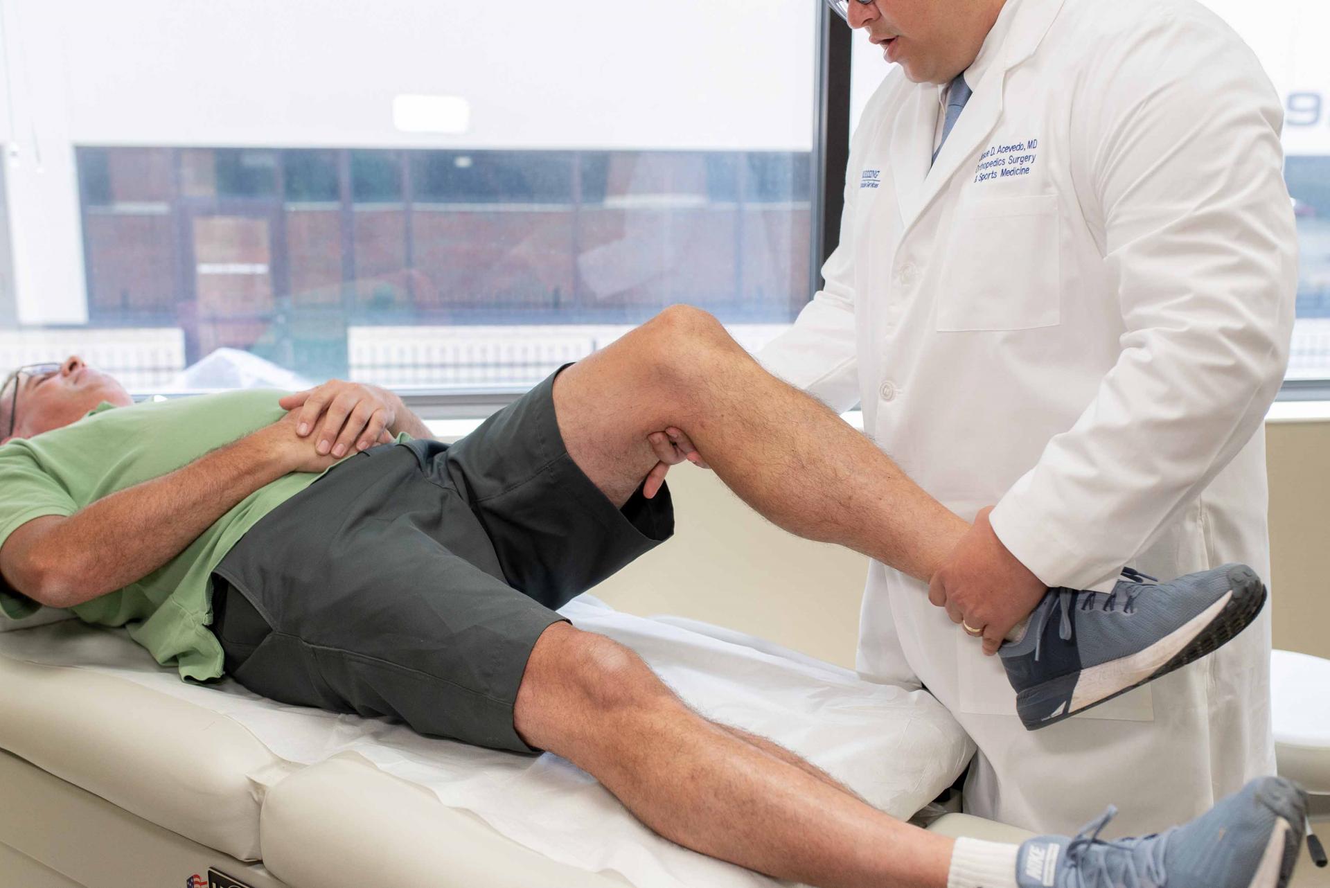 Dr. Acevedo assessing knee