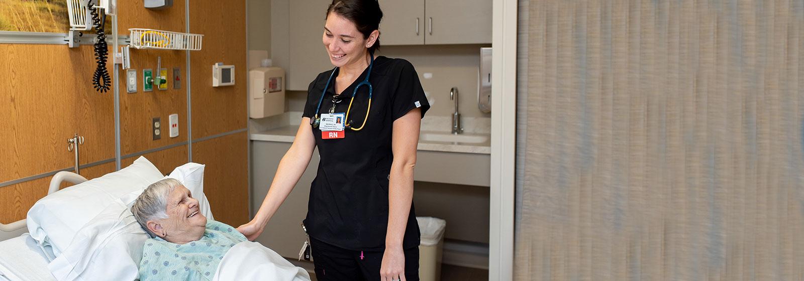 Nurse smiling at patient