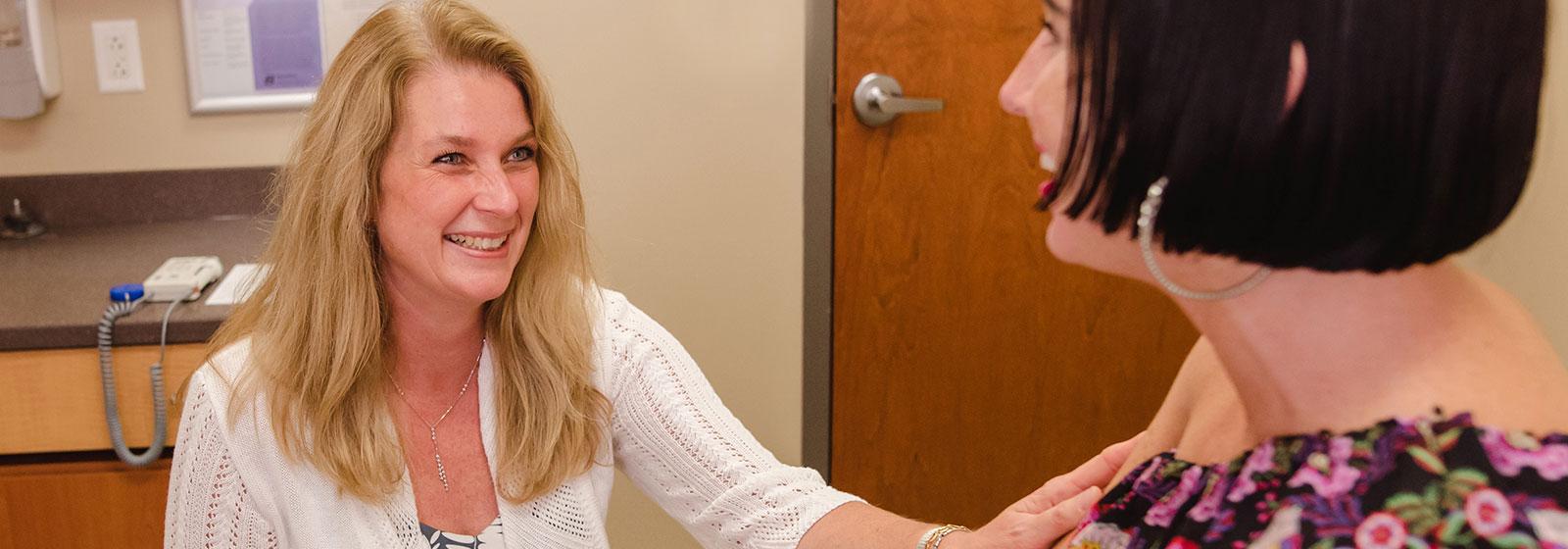 Dr. Dietrich talking with patient