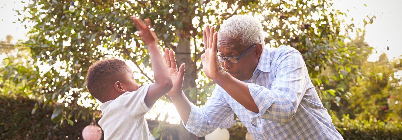 man and boy high fiving