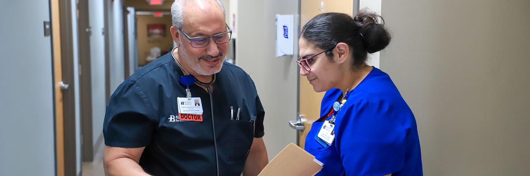 Doctor talking with nurse