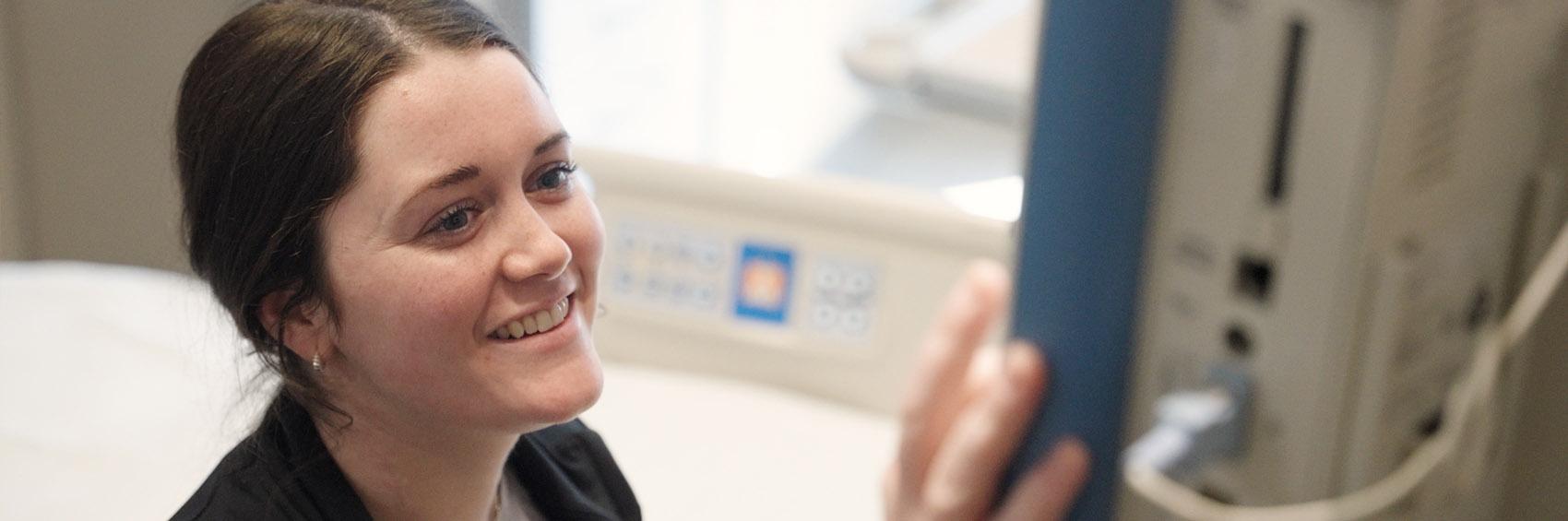 Nurse checking monitor